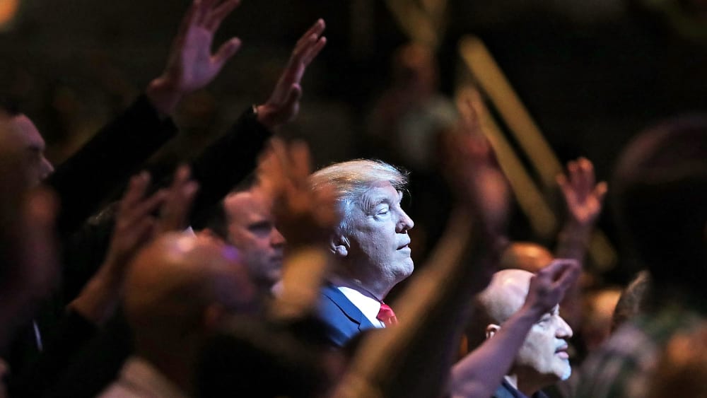 Donald Trump attends a worship service.