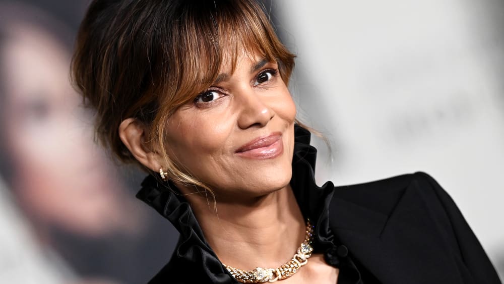 Halle Berry poses for photos at a red carpet event.