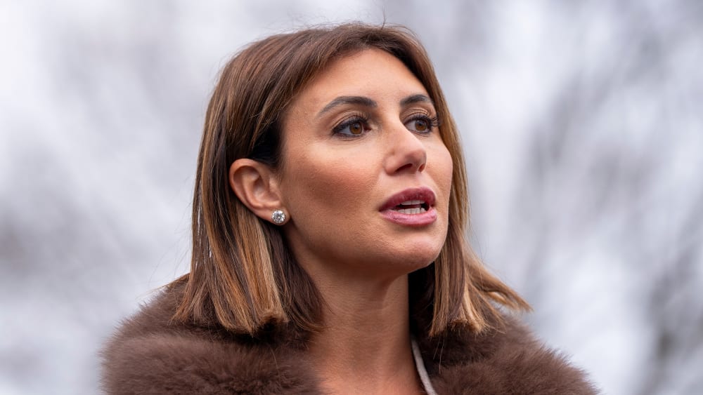 A neck-up photo of Alina Habba outside.