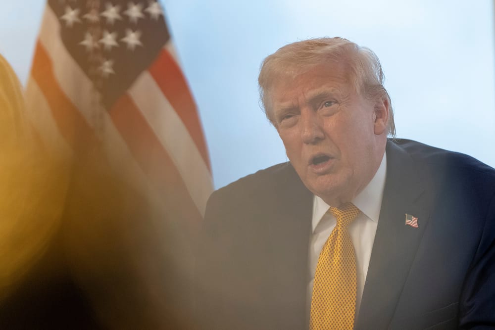 President Donald Trump speaks during a call with service members at his Mar-a-Lago club on Dec. 24, 2025, in Palm Beach, FL.