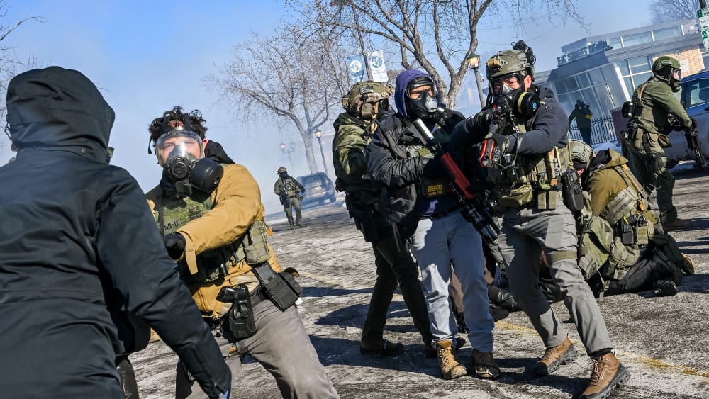 ICE agents are trying to stop protesters.