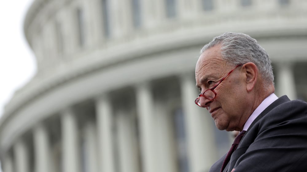 Chuck Schumer, with the Capitol blurred in the background.