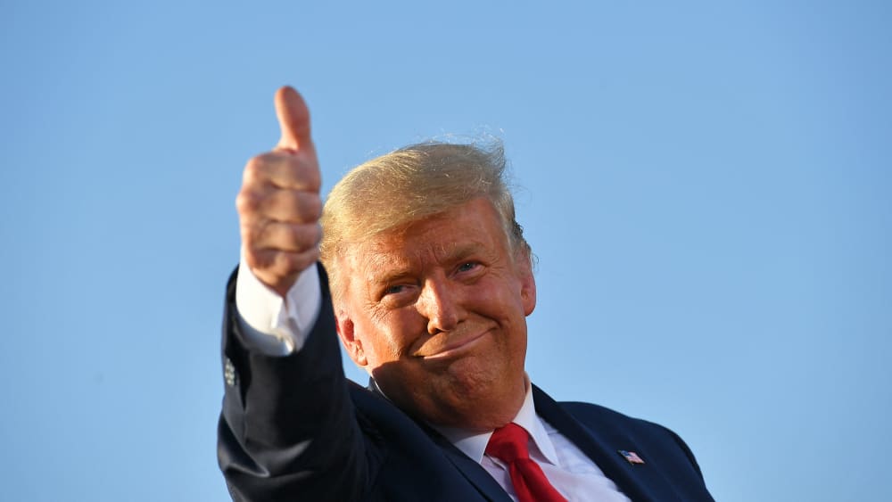 President Donald Trump gives a thumbs up as he leaves a rally in Tucson, A.Z.