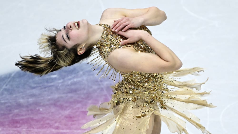 Alysa Liu bends backwards, her hands on her chest, while skating during the 2026 Winter Olympics.