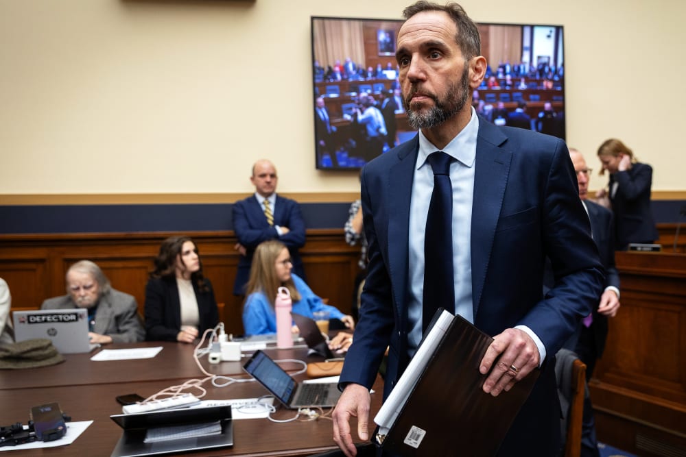 Jack Smith walks toward the desk after a break during his testimony.