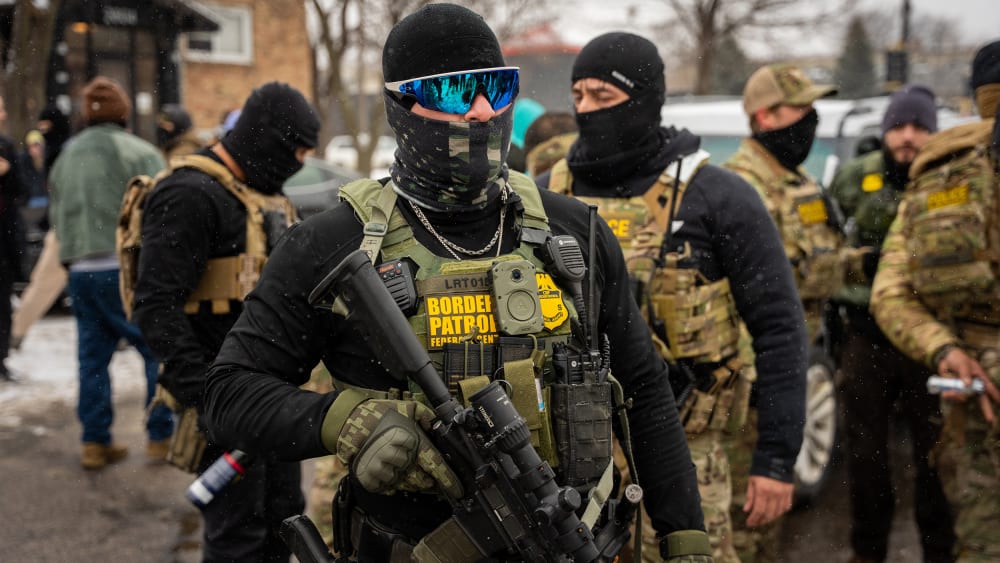 Federal agents stand together.