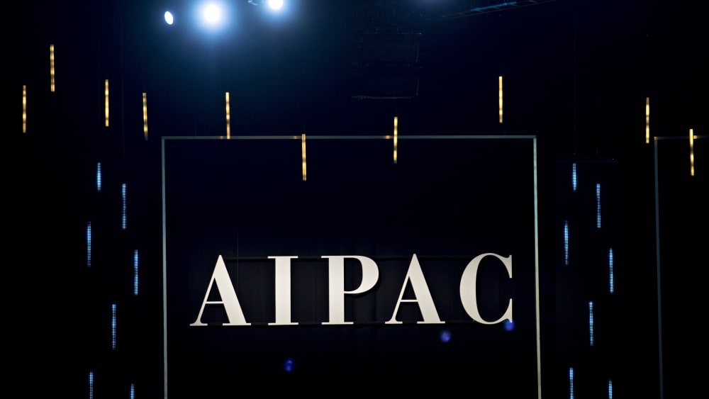 The word AIPAC is seen on a black background.