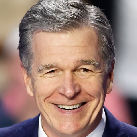 Roy Cooper; Michael Whatley.