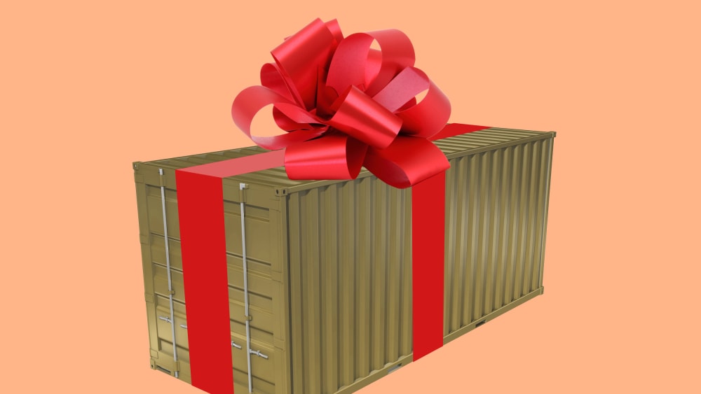 An illustration of a shipping container with a bow on top