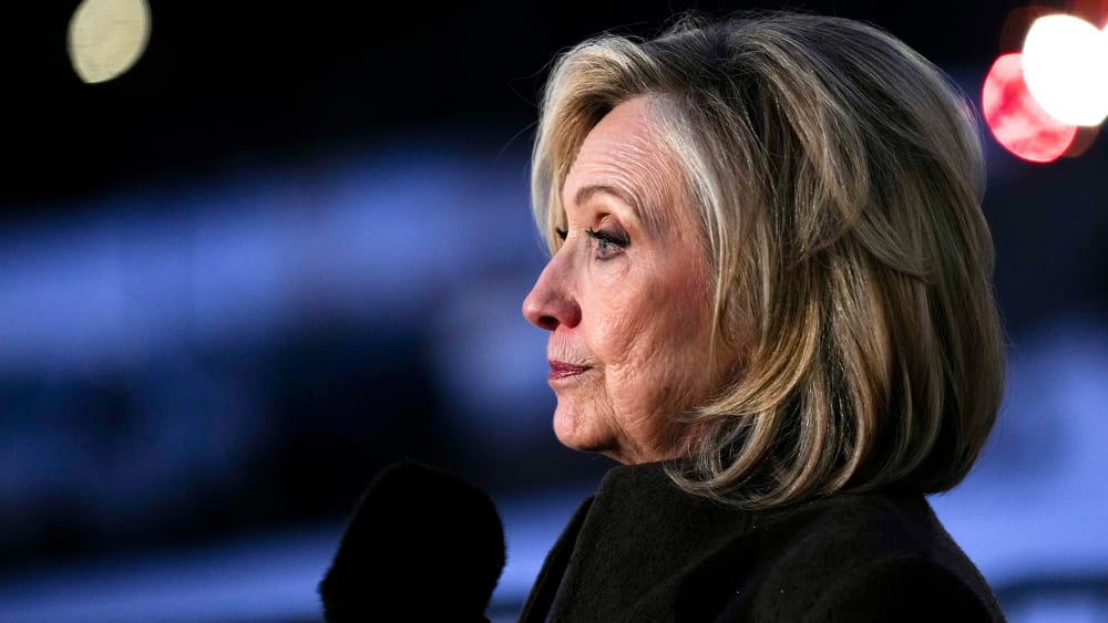 Hillary Clinton is seen from the side as she speaks to the press in this closeup shot.