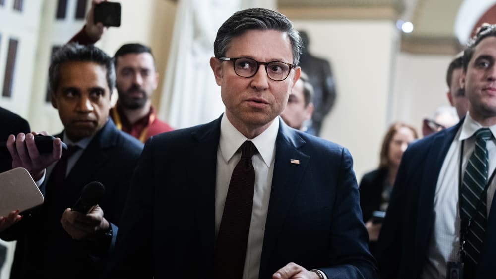 Speaker of the House Mike Johnson, R-La., talks with reporters in the U.S. Capitol during the last votes of the year.