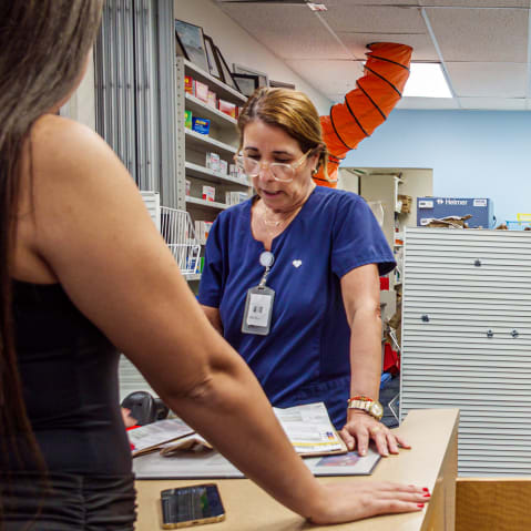 Two pharmacists at work at a CVS Pharmacy.