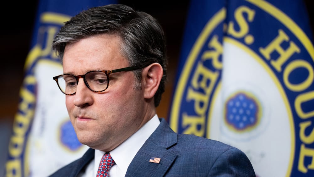 Mike Johnson looking down.