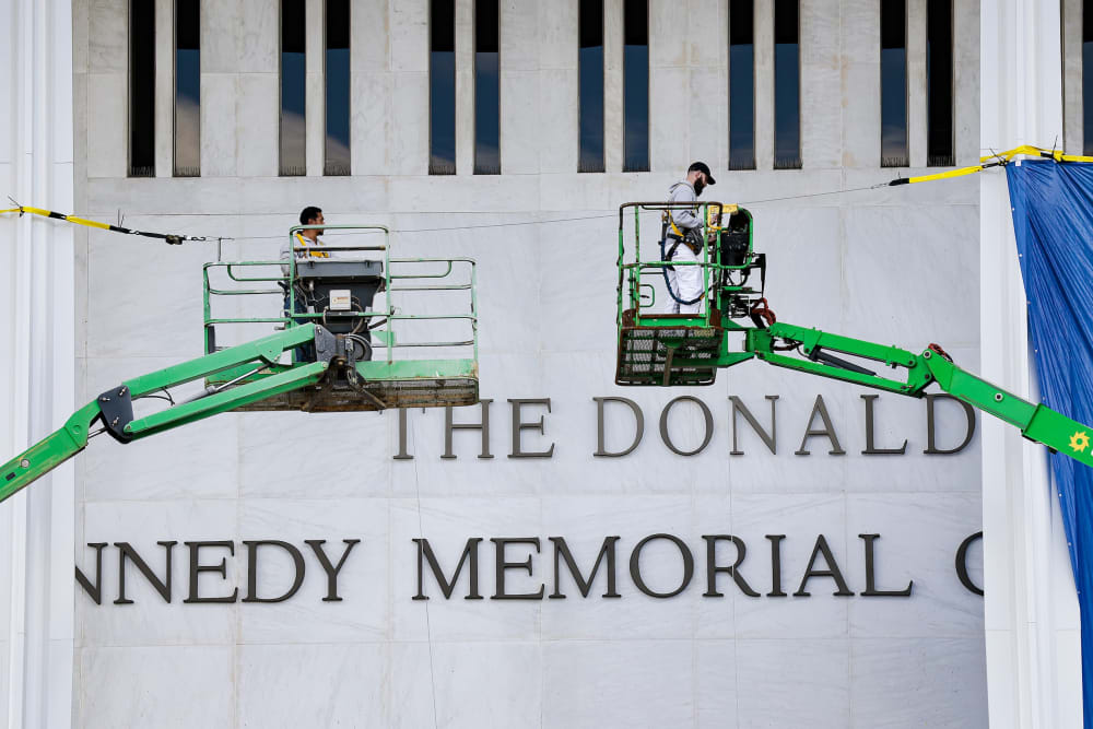 Workers adjust the name of the &ldquo;John F. Kennedy Memorial Center for the Performing Arts" on Dec. 19, 2025, in Washington, D.C.