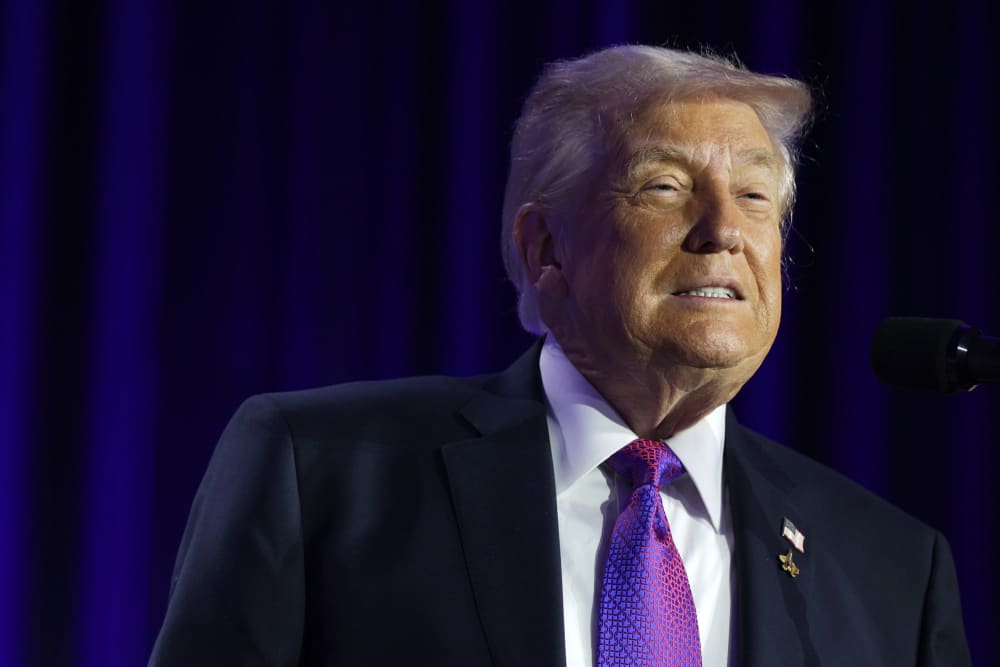 Donald Trump speaks at the podium.