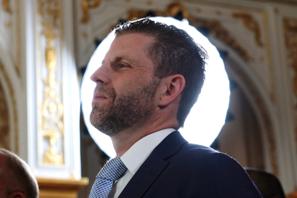 Eric Trump's profile is seen in front of a round white light source.