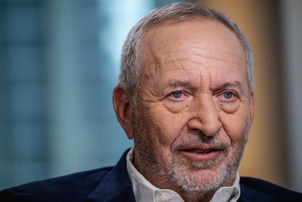 Larry Summers face is seen in a very closeup shot.