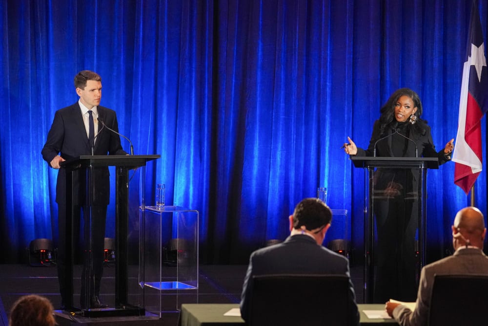 James Talarico, left and Jasmine Crockett seen on stage during a debate.