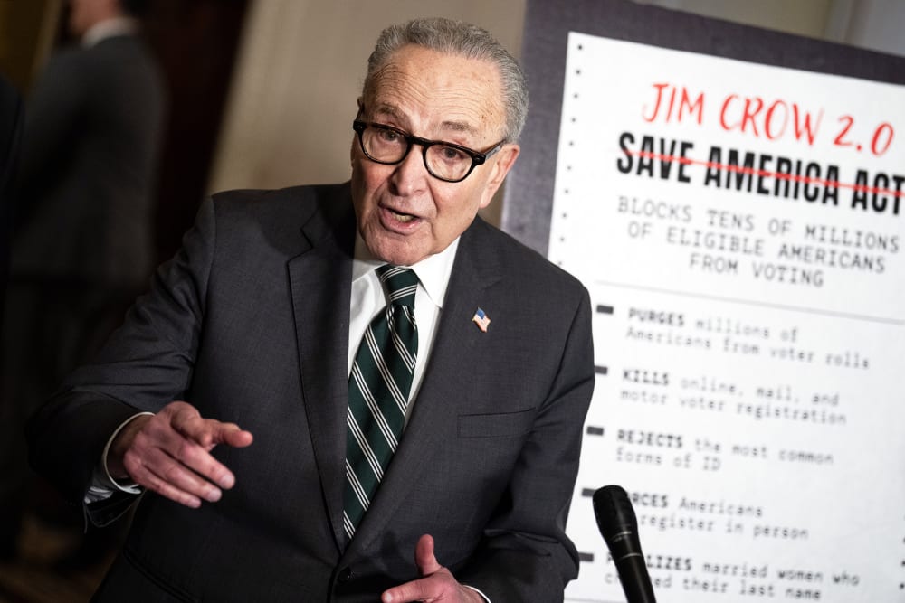 Charles Schumer conducts a news conference.