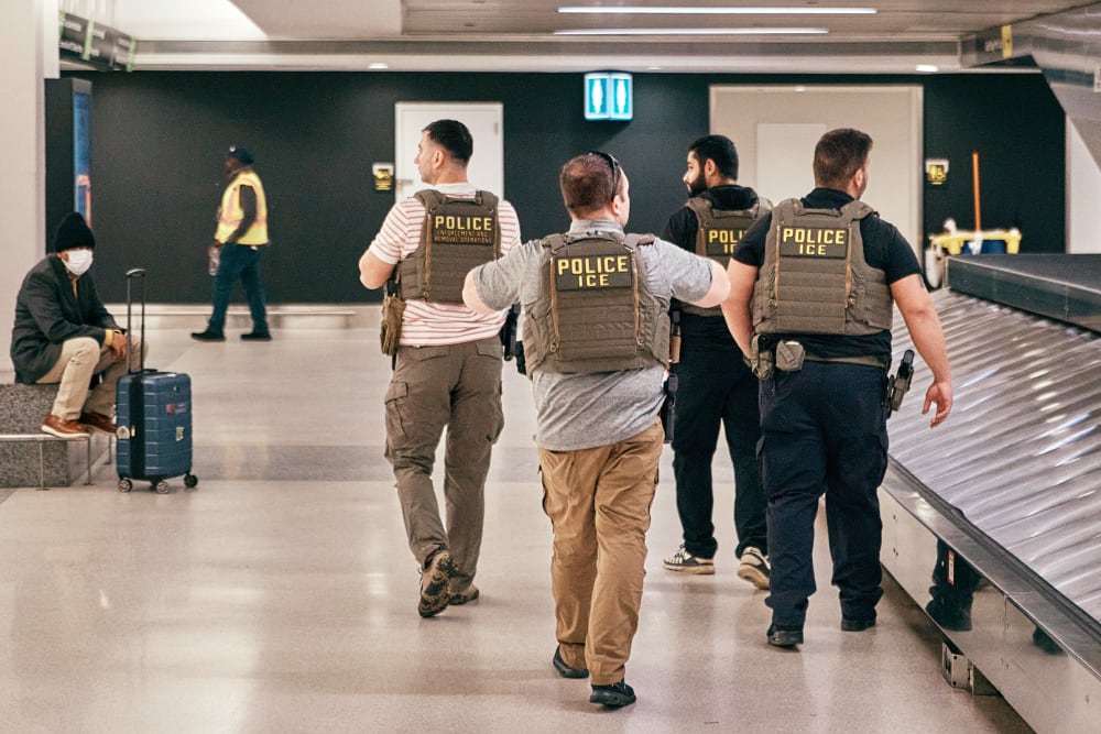 ICE agents patrol inside Newark Liberty International Airport.