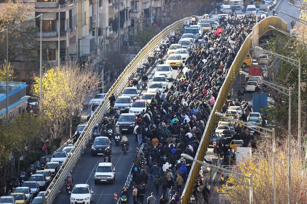 Protesters march in downtown Tehran, Iran, Monday, Dec. 29, 2025.