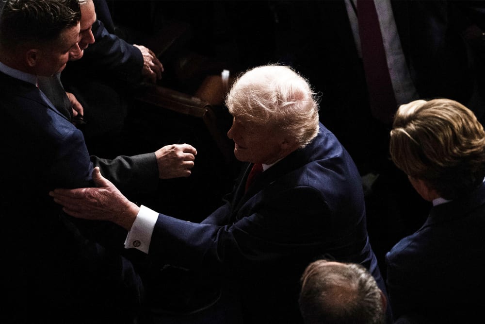 President Donald Trump leaves the House Chamber after concluding his State of the Union address at the US Capitol.