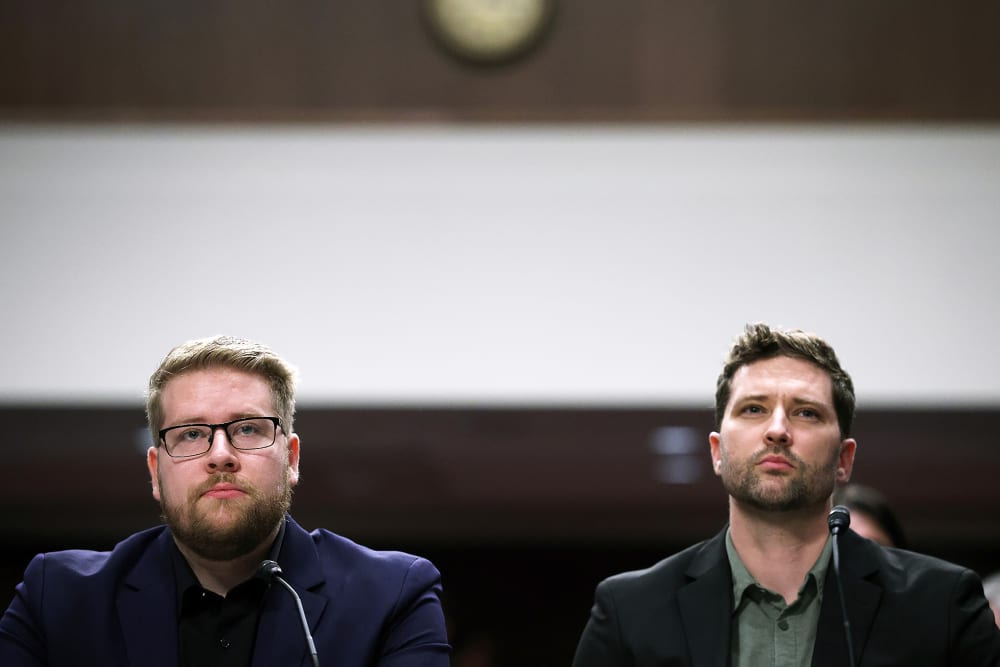 Luke Ganger and Brent Ganger prepare to speak during a public forum on violent use of force by Department of Homeland Security (DHS) agents at the Dirksen Senate Office Building on Capitol Hill.