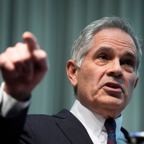Larry Krasner gestures with his hand.
