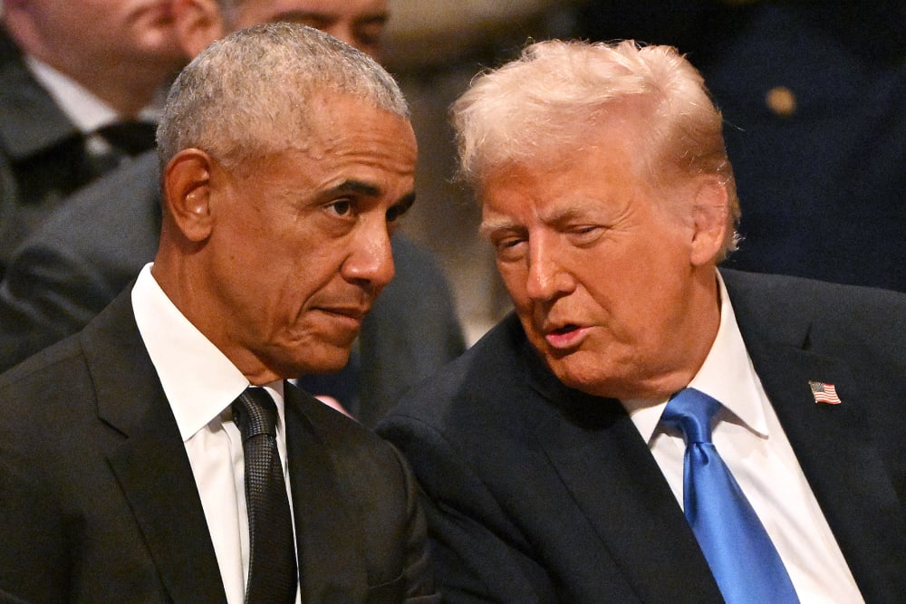 Barack Obama speaks with Donald Trump at the Washington National Cathedral.