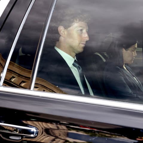 Mark Zuckerberg, left, inside a car.