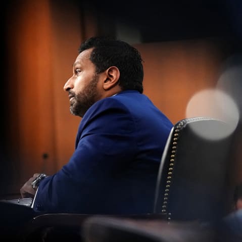 Kash Patel is seen from bottom left side.