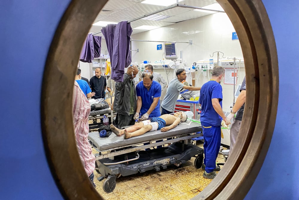 Palestinians who were injured in Israeli fire receive care at Nasser hospital in the southern Gaza Strip.