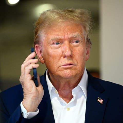 Donald Trump talks on the phone.