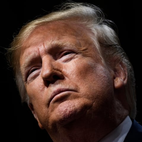 A close-up of Donald Trump looking stoic.