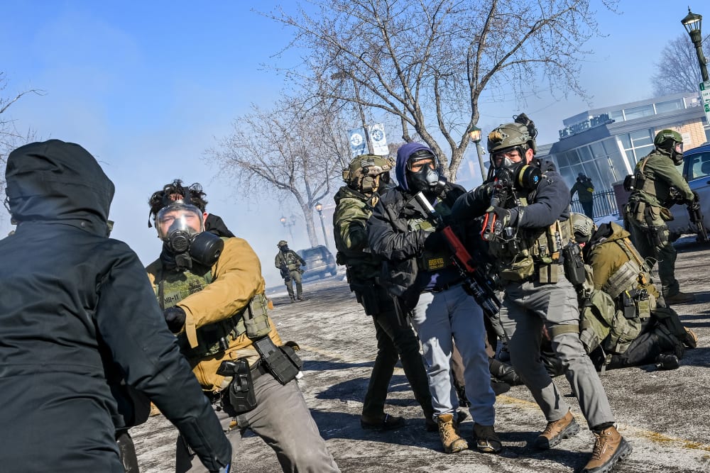 ICE agents are trying to stop protesters.