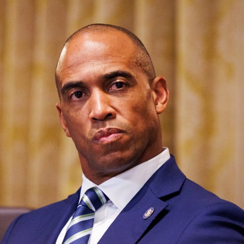 Scott Turner looks on in this closeup shot.