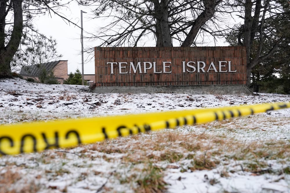Police tape hangs outside the Temple Israel synagogue.