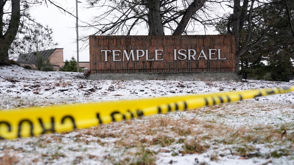 Police tape hangs outside the Temple Israel synagogue.