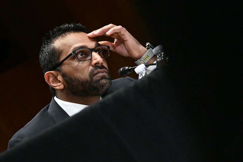 Kash Patel with his hand on his forehead.