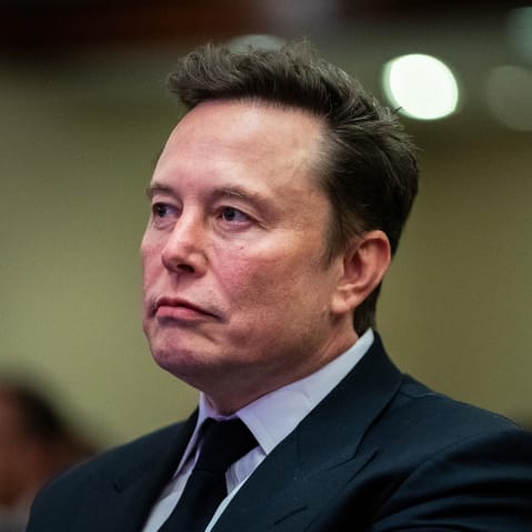 Elon Musk without much expression on his face.