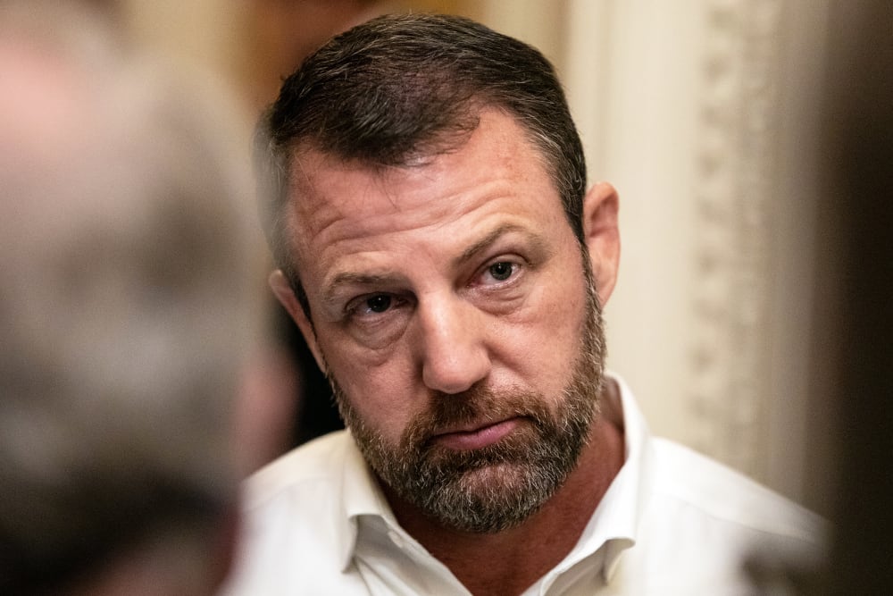 Sen. Markwayne Mullin speaks to reporters on Capitol Hill.
