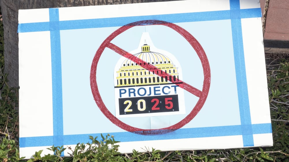 An anti-Project 2025 sign in front of Tucson's Federal Building in Arizona.