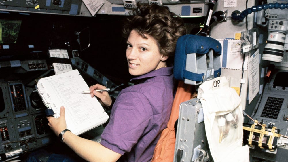 Portrait of American NASA astronaut Eileen Collins at the Pilot's Station on Shuttle Discovery.