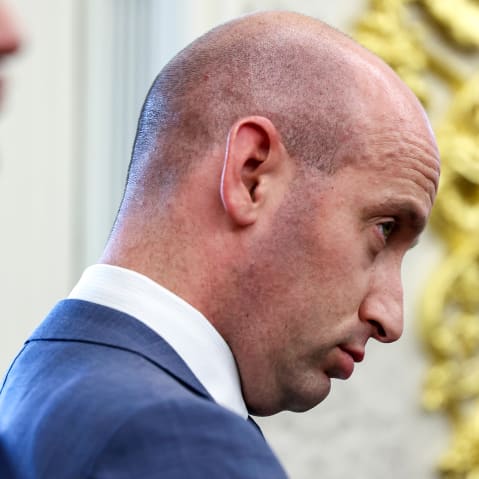 Stephen Miller looks down in a closeup photo. He is seen from the side.