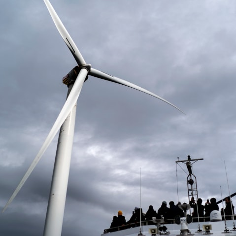 Guests tour one of the turbines of the United States&rsquo; first offshore wind farms off the coast of Block Island, R.I., on Oct. 17, 2022.