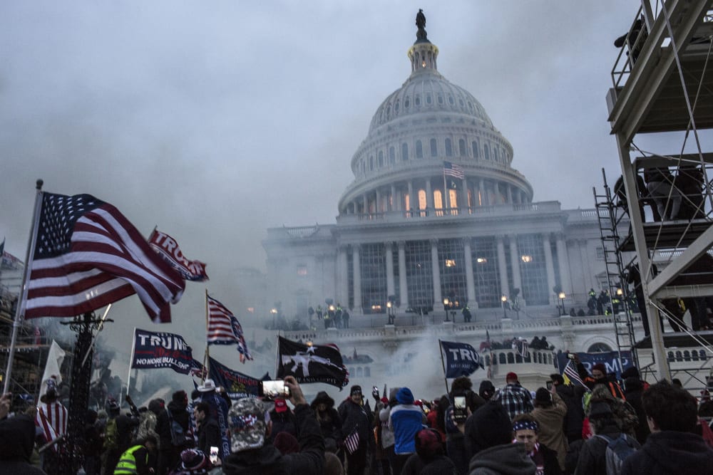 Security forces respond with tear gas after the President Donald Trump's supporters breached the US Capitol security.