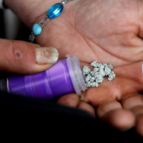A man shows an eight ball, or 3.5 grams, of fentanyl.