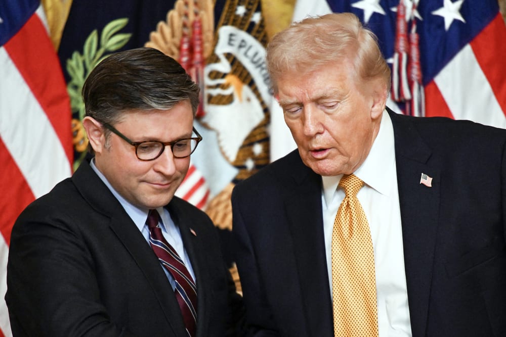 President Donald Trump shakes hands with Speaker of the House Mike Johnson during a lunch with the Kennedy Center Board Members.