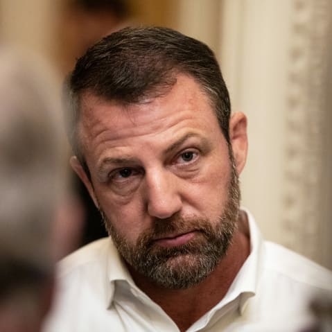 A close up of Markwayne Mullin cocking his head.