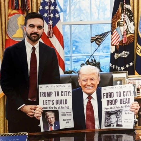 Donald Trump holds two cover pages of Daily News one of which reads "Trump To City: Let's Build" about building affordable housing. This cover page is made up and given to Trump by Mamdani as a gift.